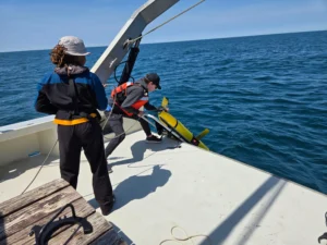 An underwater glider is deployed by researchers into the ocean